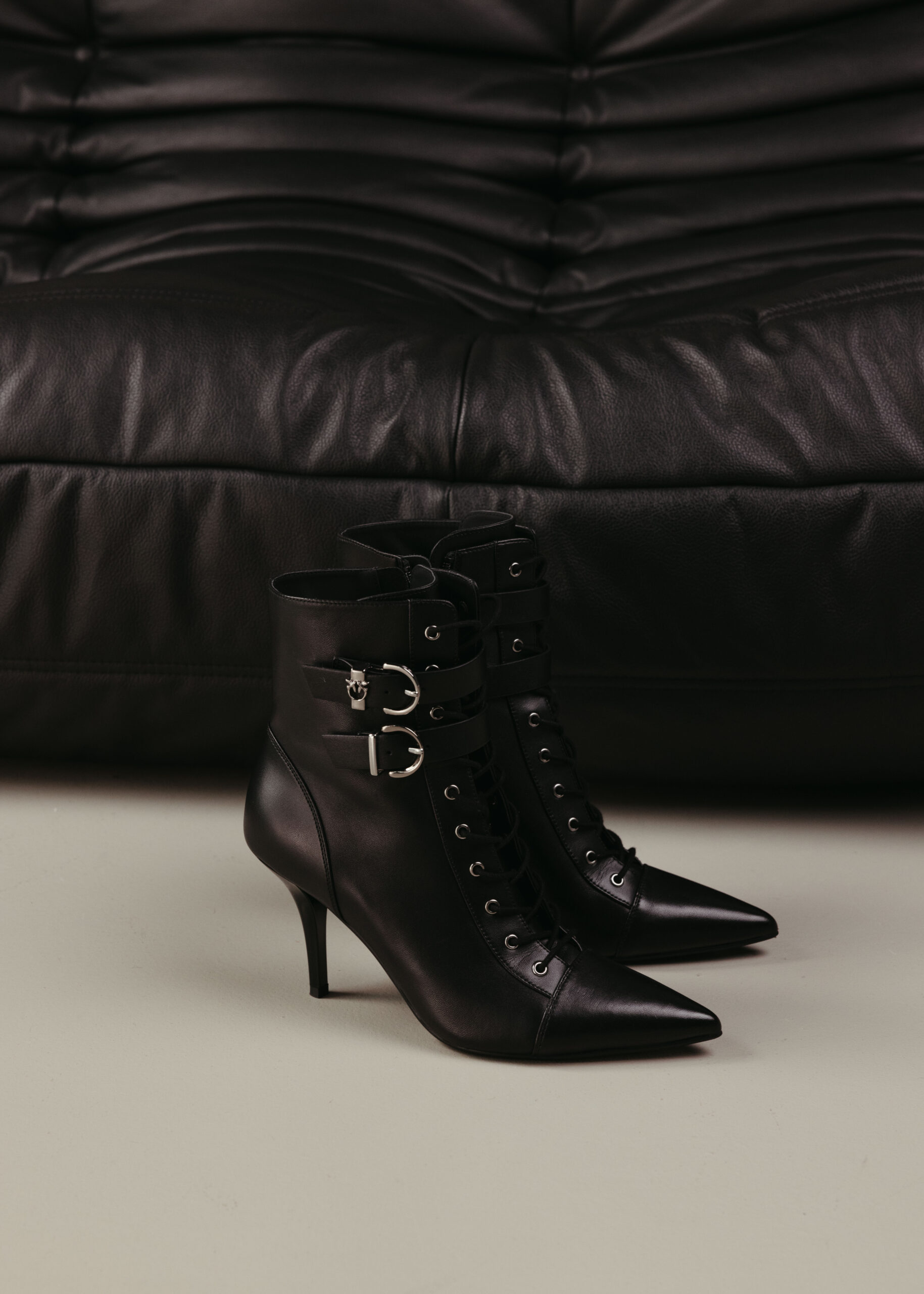 Black high-heeled ankle boots.